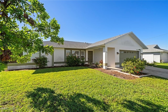 ranch-style home featuring a front yard and a garage