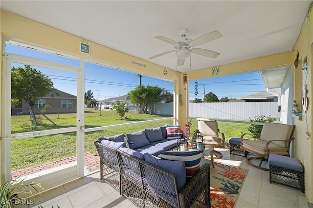 sunroom / solarium with ceiling fan