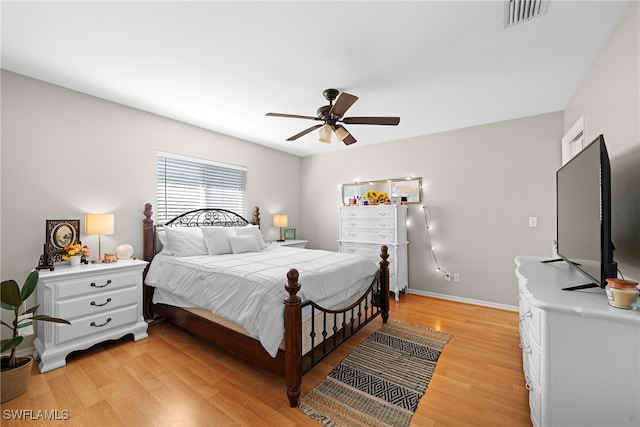 bedroom featuring ceiling fan and light hardwood / wood-style floors