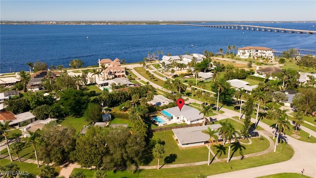 birds eye view of property featuring a water view