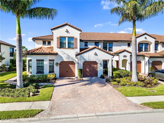 mediterranean / spanish-style home featuring a garage