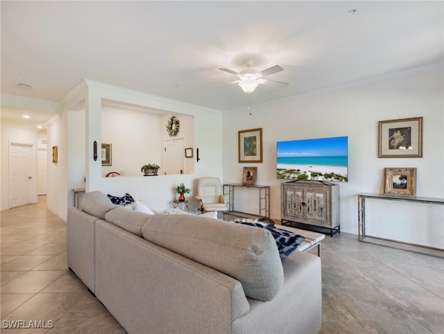 tiled living room featuring crown molding and ceiling fan