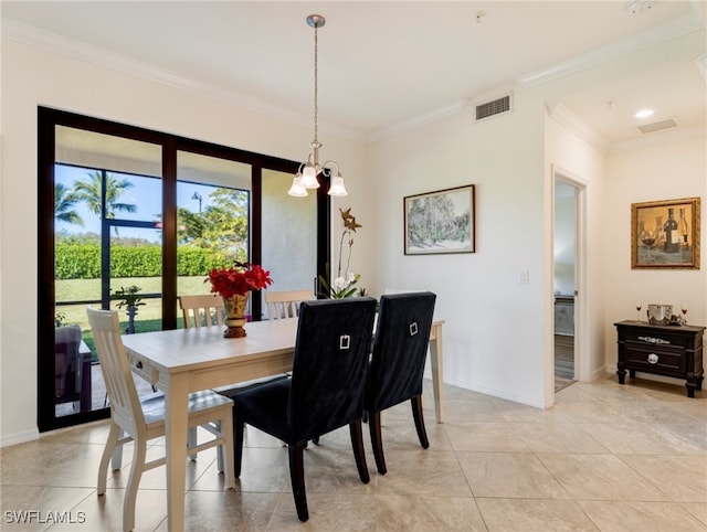 dining area with a chandelier, light tile patterned floors, and ornamental molding