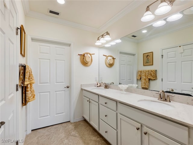 bathroom with tile patterned flooring, vanity, and ornamental molding