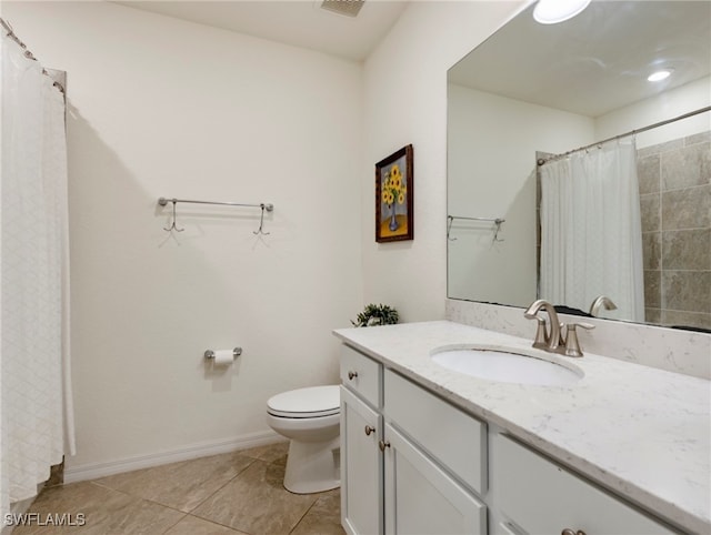 bathroom featuring tile patterned floors, vanity, toilet, and curtained shower