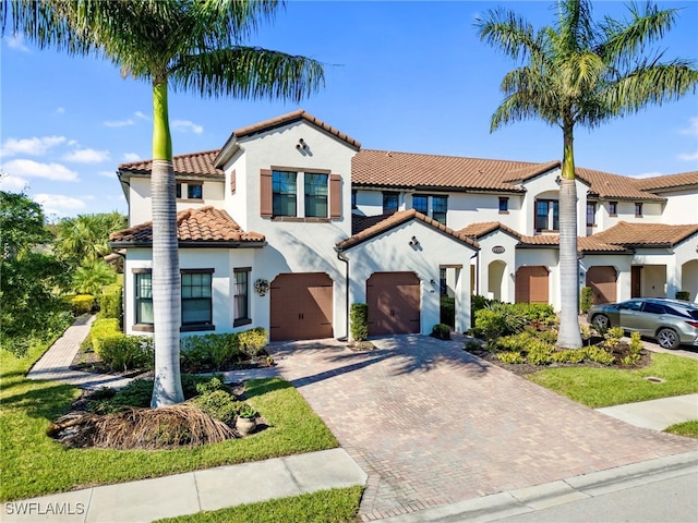 mediterranean / spanish-style home featuring a garage