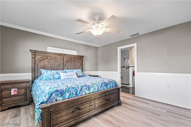 bedroom with ensuite bathroom, ceiling fan, and light hardwood / wood-style floors