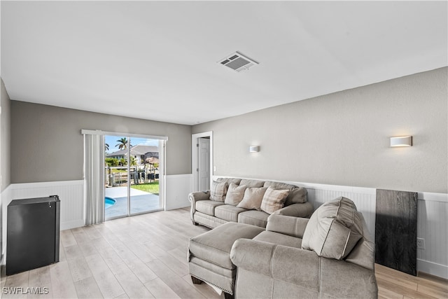 living room with light hardwood / wood-style floors