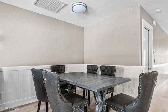 dining area featuring light wood-type flooring