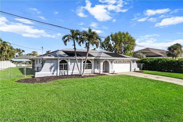 ranch-style home with a garage and a front lawn