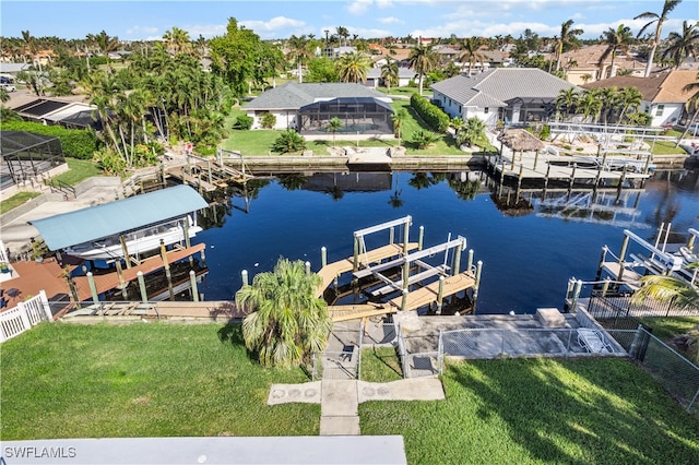 dock area featuring a yard and a water view