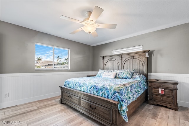 bedroom with light wood-type flooring and ceiling fan