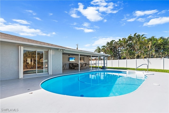 view of pool featuring a patio area and ceiling fan