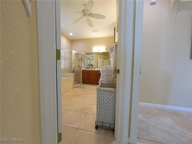 bathroom with plus walk in shower, vanity, tile patterned floors, and ceiling fan