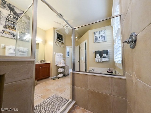 bathroom featuring tile patterned floors, vanity, a shower, and ceiling fan