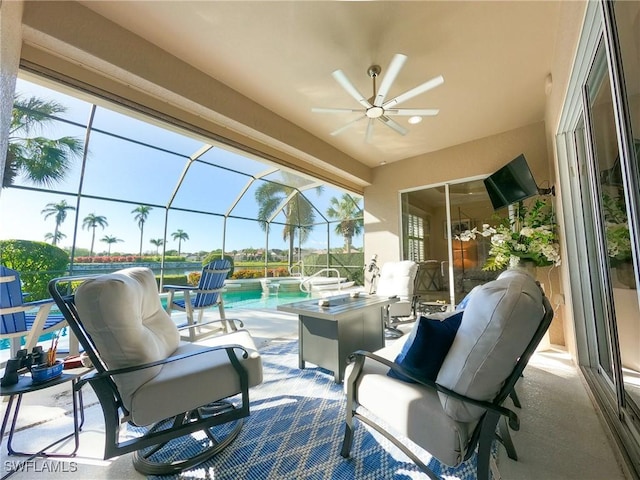 view of patio / terrace with ceiling fan and glass enclosure