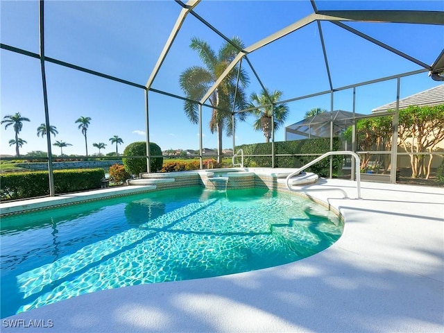 view of pool with glass enclosure