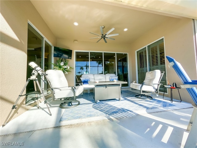 view of patio featuring ceiling fan and an outdoor living space