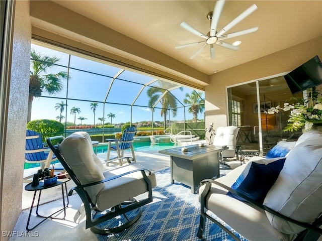 view of patio / terrace featuring outdoor lounge area, glass enclosure, and ceiling fan