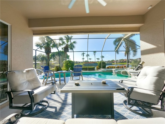 view of patio / terrace with ceiling fan and glass enclosure