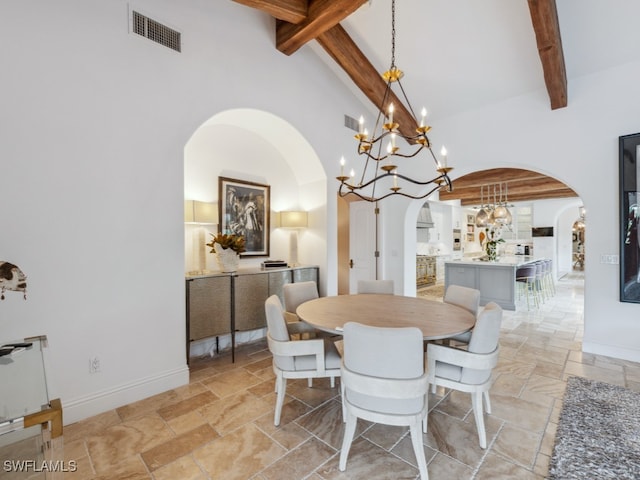 dining room featuring beamed ceiling and high vaulted ceiling