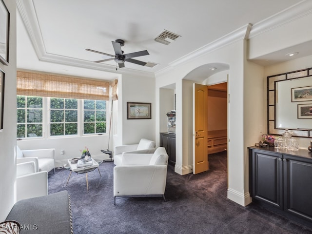 interior space with crown molding and ceiling fan