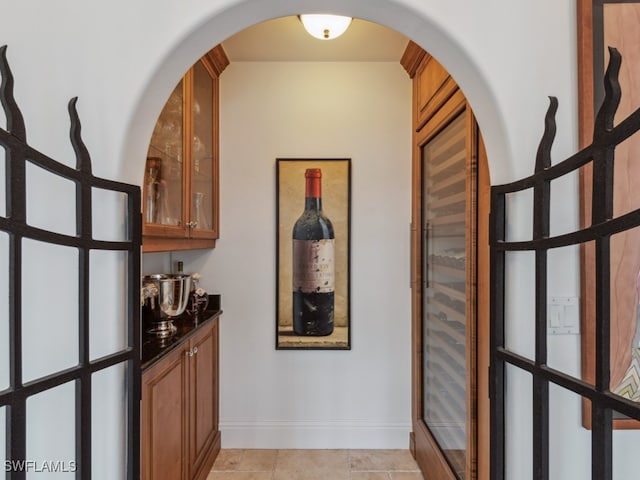 hallway with light tile patterned floors