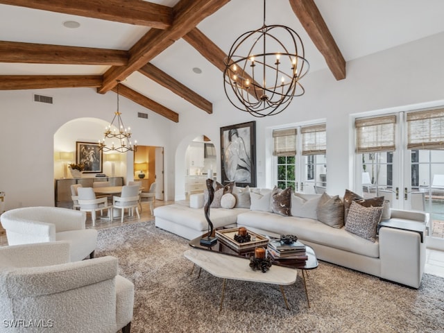 living room featuring beam ceiling, an inviting chandelier, high vaulted ceiling, and french doors