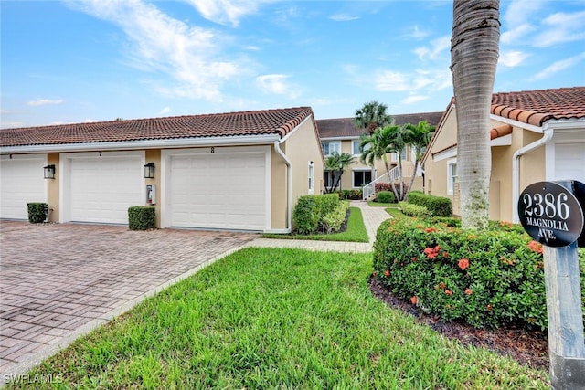 exterior space with a front lawn and a garage