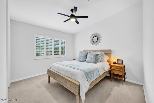 bedroom featuring ceiling fan and light carpet