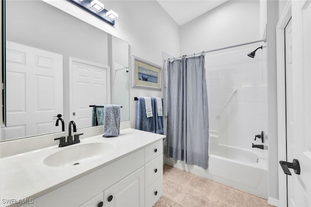 bathroom with tile patterned flooring, shower / tub combo, and vanity