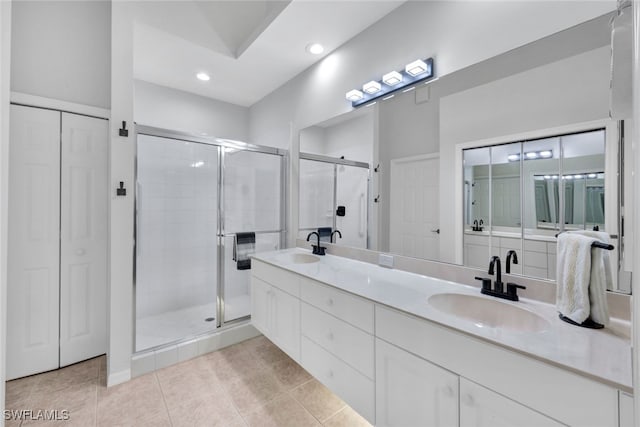 bathroom featuring vanity, tile patterned floors, and an enclosed shower