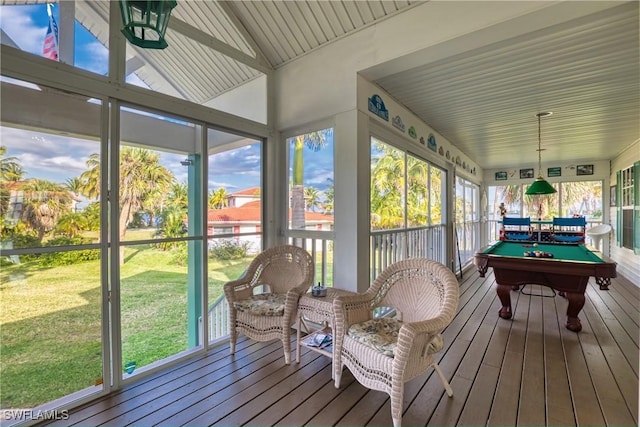 sunroom / solarium with plenty of natural light, lofted ceiling, and pool table