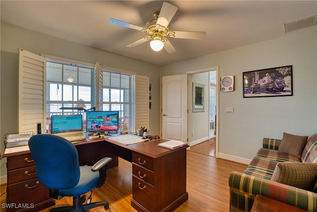 office featuring light hardwood / wood-style floors and ceiling fan