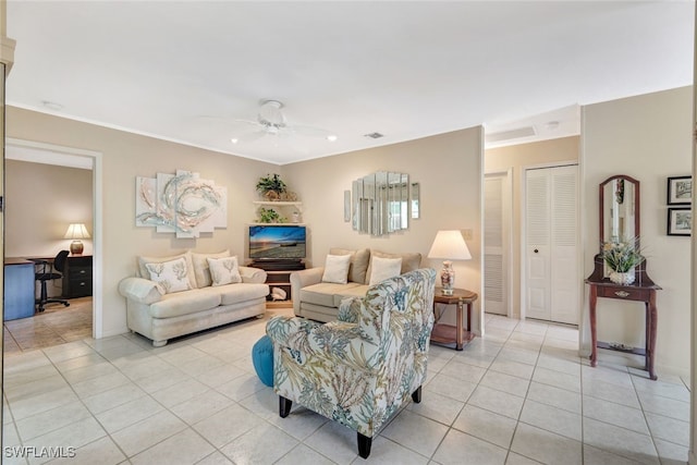 living room featuring ceiling fan and light tile patterned flooring