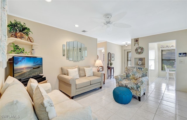 living room with ceiling fan and light tile patterned floors