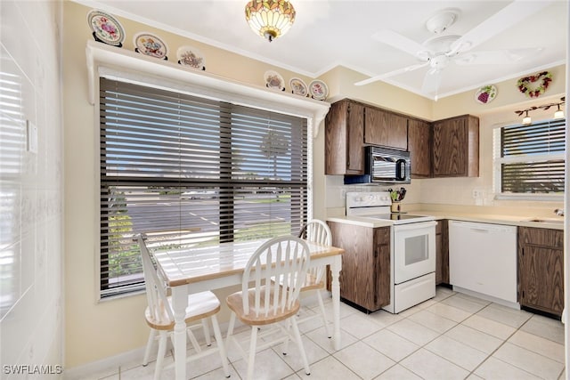 kitchen featuring ceiling fan, crown molding, white appliances, dark brown cabinets, and light tile patterned floors