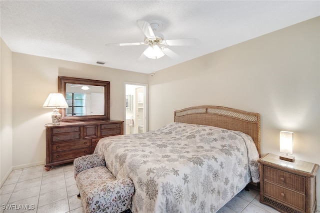 1204 SE 6th Ter Unit 67, Cape Coral, FL 33990 - tiled bedroom featuring baseboards, ceiling fan, and ensuite bath