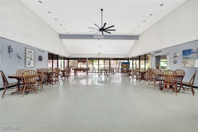 dining area with ceiling fan, beamed ceiling, and high vaulted ceiling