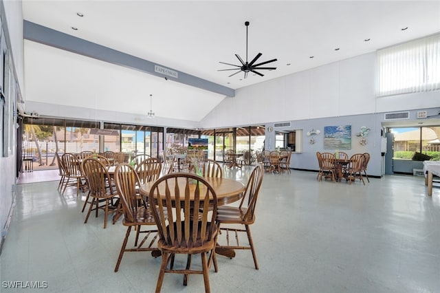 dining space featuring beamed ceiling, high vaulted ceiling, and ceiling fan