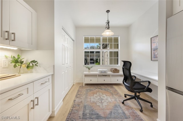 office area with light wood finished floors