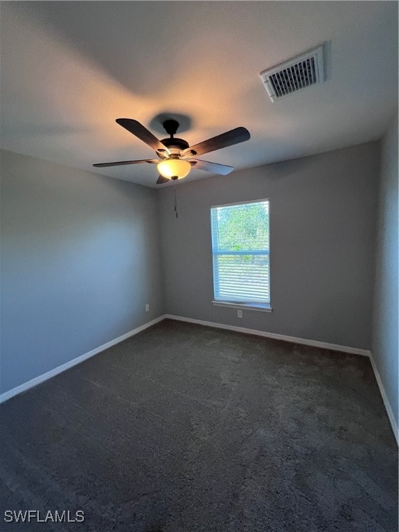 carpeted empty room with ceiling fan