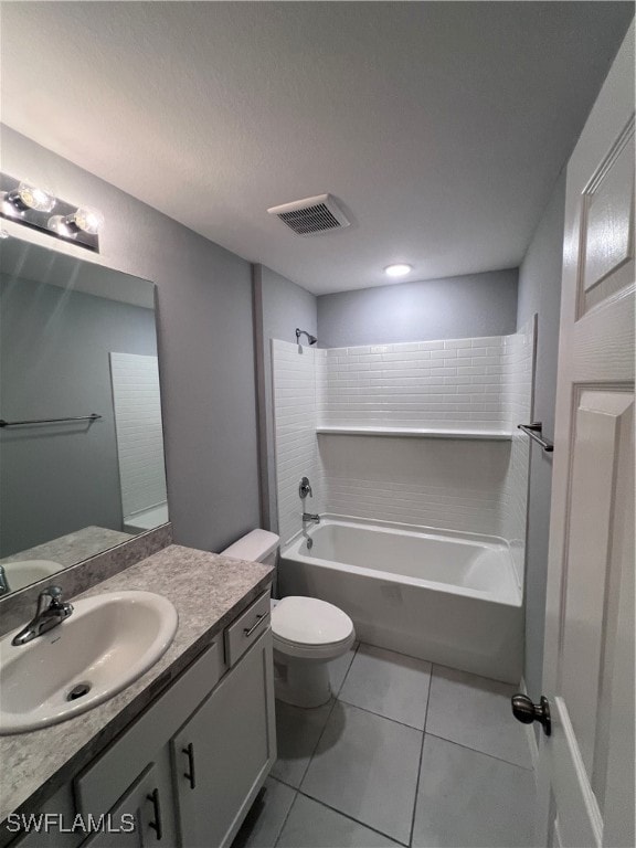 full bathroom featuring tile patterned floors, vanity, toilet, and shower / tub combination