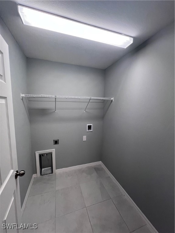 clothes washing area with washer hookup and hookup for an electric dryer