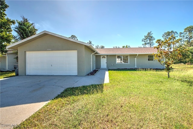 ranch-style home with a garage and a front lawn