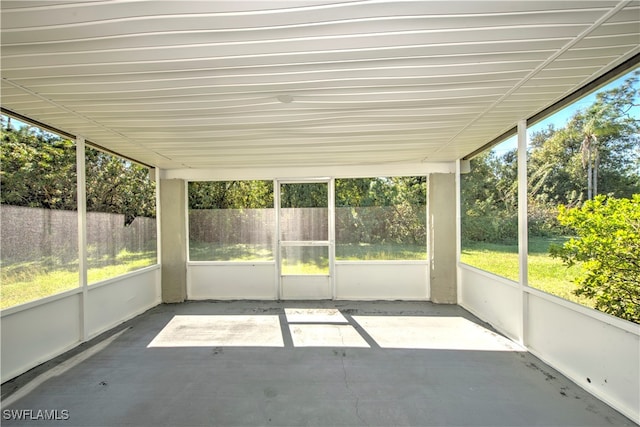 unfurnished sunroom featuring a wealth of natural light