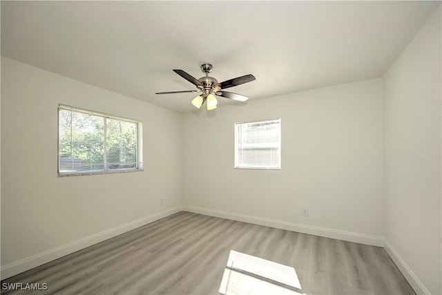 empty room featuring light hardwood / wood-style floors and ceiling fan