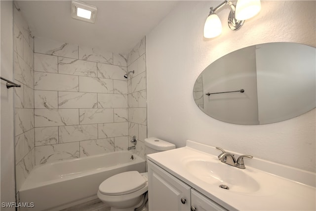 full bathroom with vanity, toilet, and tiled shower / bath