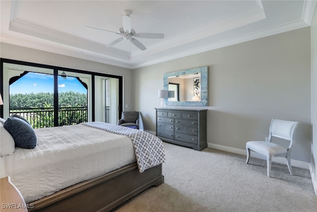 bedroom featuring access to outside, light colored carpet, a raised ceiling, and ceiling fan