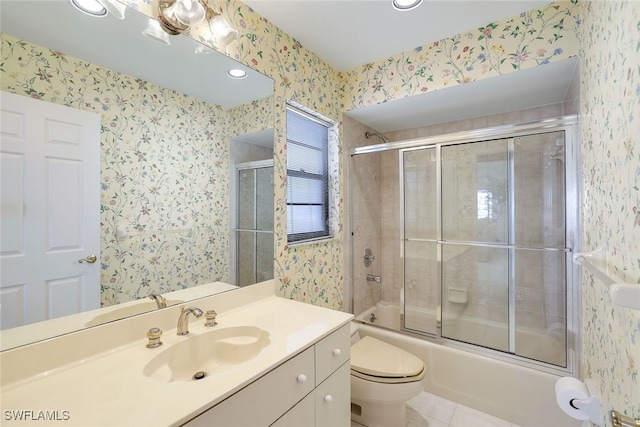 full bathroom with tile patterned flooring, vanity, toilet, and bath / shower combo with glass door